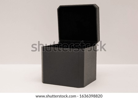 Open gift box in black on a light background. Space for text, copy space.