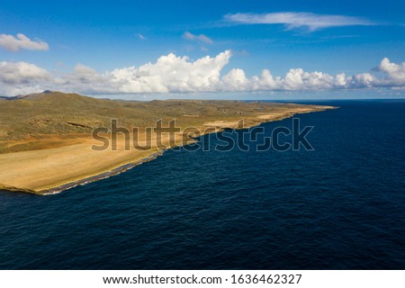 Aerial view of coast of Curaçao in the Caribbean Sea with turquoise water, cliff, beach and beautiful coral reef around Boka Ascension