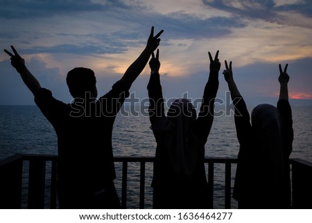 Happy Family enjoying the sunset