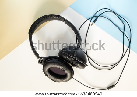 Stereophonic headset worn out and broken without intensive use and after a very short time, perfect example of "Planned Obsolescence". Royalty-Free Stock Photo #1636480540