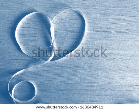 Heart made of ribbon. PANTONE Blue, Classic Blue, Phantom Blue