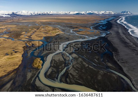 Stunning Early Spring Aerial View of Icelandic Rivers Flowing into the Ocean