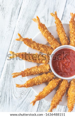 Shrimp tempura with sauce on the plate: top view Royalty-Free Stock Photo #1636488151