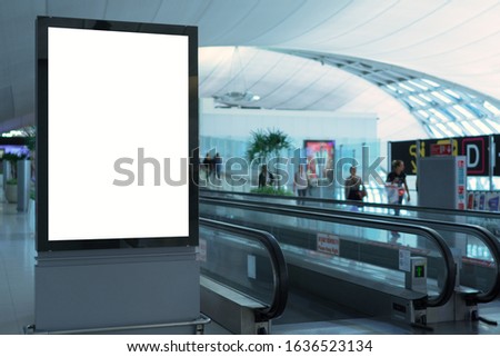 Blank white mock up of vertical light box billboard at the airport
