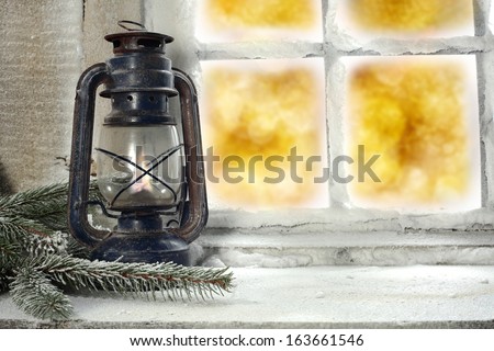 old lamp on window sill 