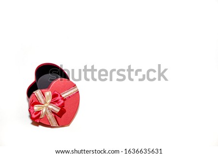 red gift box in the shape of a heart on a white background isolated, open box