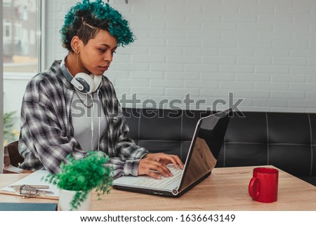 young student girl or business woman typing on the computer at home or office