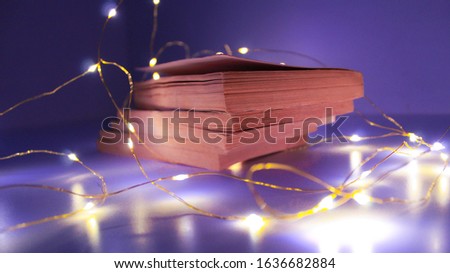 artistic photography with warm and bright lights effect of vintage and retro style old books