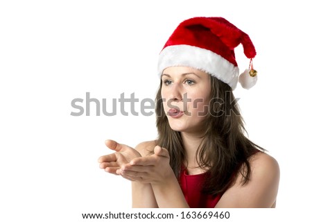 Brunette woman wearing a Santa Claus costume holding her hands at her face, isolated on white background
