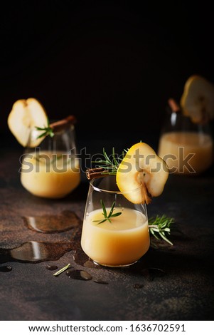 Healthy soft drink with pears, rosemary and cinnamon, selective focus image
