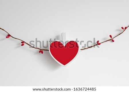 Handmade Valentine's Day garland. Valentine concept, on white background. Garland of wooden red heart on a rope. Flat lay image of decoration valentine's day background concept. Heart, heart shape
