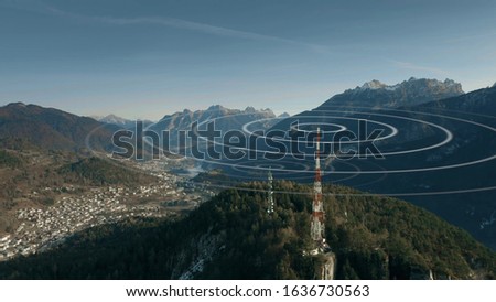 Aerial view of antennas transmitting radio signals in rural mountainous area Royalty-Free Stock Photo #1636730563