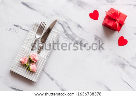 Valentine's Day. Holiday table setting. 
 Gray marble background top view, mockup 