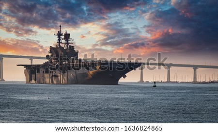 A US Navy ship departs San Diego Bay for the Pacific Ocean. Royalty-Free Stock Photo #1636824865