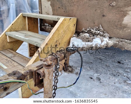 trailer hitch and wooden steps
