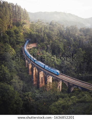 train crossing nine arch bridge in ella sri lanka Royalty-Free Stock Photo #1636852201