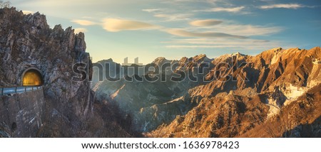 Alpi Apuane mountain road pass and tunnel view at sunset. Movie location in Carrara, Tuscany, Italy. Europe. Royalty-Free Stock Photo #1636978423
