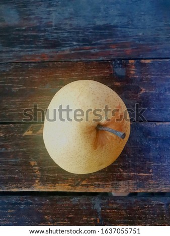 Asian pear on wooden table.