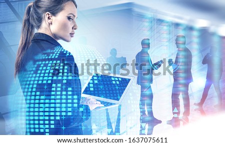 Beautiful young engineer with laptop working in blurry data center with double exposure of planet hologram and cityscape. Her team in background. Concept of programming and big data. Toned image