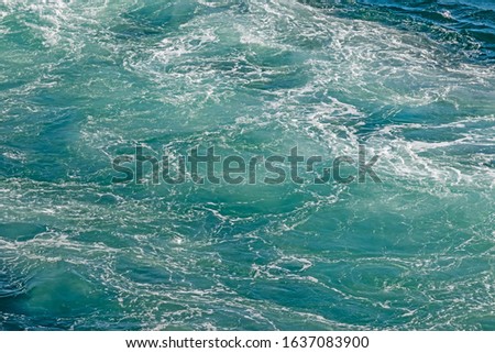 turquoise color sea and ship wave in the sea