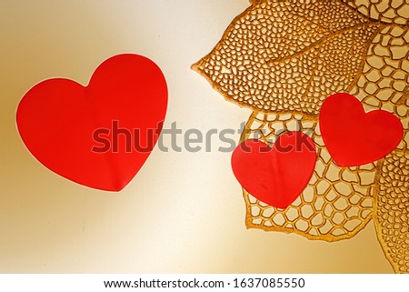 Golden background with red hearts. Love heart frame. Happy mother's day concept. Love symbol. Holiday card background, copy space for text.