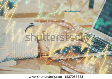 Multi exposure of stock market graph with man working on laptop on background. Concept of financial analysis.