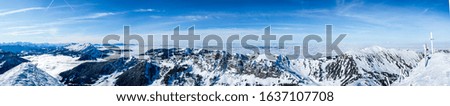 beautiful mountain panorama snow covered swiss alps. large panoramic picture of the snowy mountains in switzerland, sunny blue sky