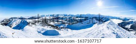 beautiful mountain panorama snow covered swiss alps. panoramic picture of the snowy mountains in switzerland, sunny blue sky