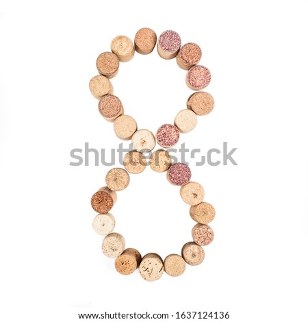 The number 8 is made from wine corks, close-up. Isolated on white background