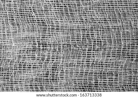 Texture of gauze fabric for abstract backgrounds a closeup, monochrome tone