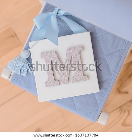canvas with a letter as a decoration in the interior, letter painting