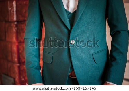CLoseup green jacket on the man