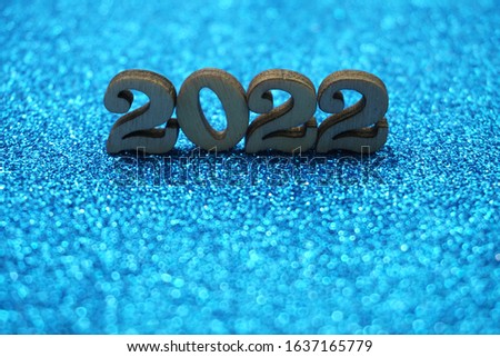 Happy New year 2022 with space copy on blue glitter background