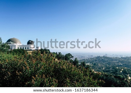 Telescope sign and panoramic city view, touristic sight, the astronomers monument, domed roof