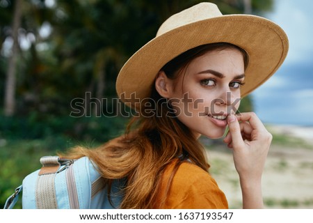 cheerful woman backpack traveling island beach destination