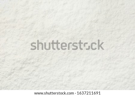 Pile of organic flour as background, top view