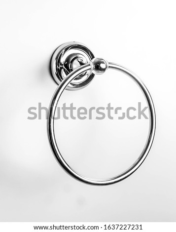 Accessories for your bathroom, chromed, chromed steel hanger. For free post production and creative photomontage. To adapt to your graphics. Polished chrome, hanging on a white background.