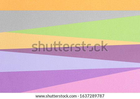 Abstract colorful geometric background made of multi-colored layers of pastel-colored paper.Not an illustration.