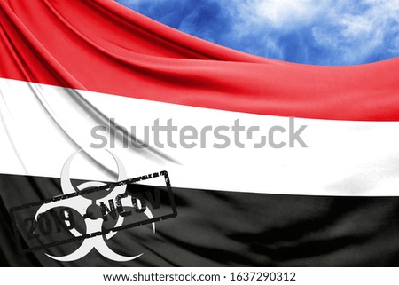 Novel coronavirus disease named 2019-nCoV with Yemen flag closeup on blue sky background