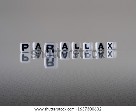 parallax concept represented by wooden letter tiles Royalty-Free Stock Photo #1637300602