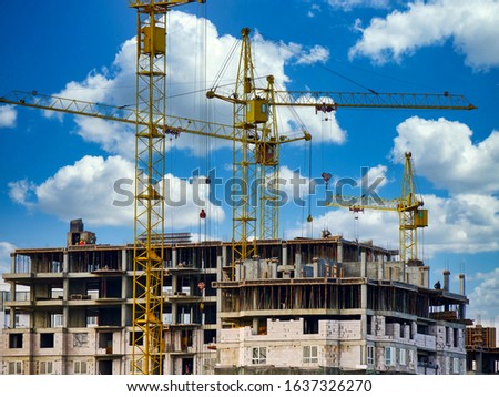 Construction site with cranes. Industrial background.