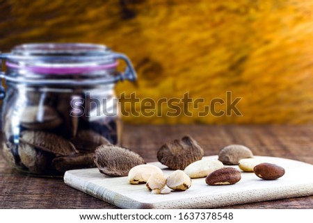 Photo of Brazil nuts, known as amazônia nut or chestnut-do-acre. Also grown in bolivia. Wooden background.