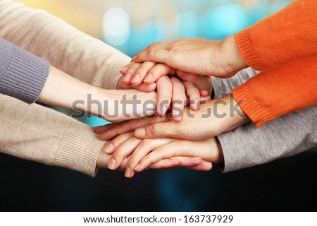 Human hands on bright background Royalty-Free Stock Photo #163737929
