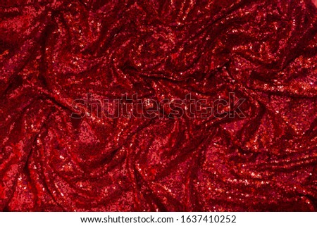 bright red shiny patchwork fabric lined with skladak as a background