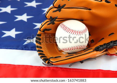 Baseball glove and ball on American flag background