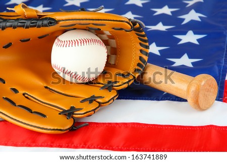 Baseball glove, bat and ball on American flag background
