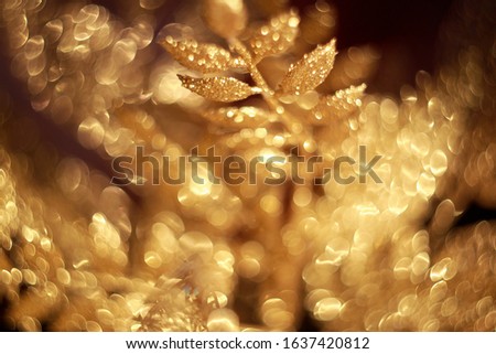 Shiny golden leaves with glitter. Christmas decoraitons. 
