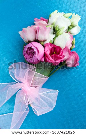 greeting card design. small bouquet on a pink background. wedding invitation. congratulation