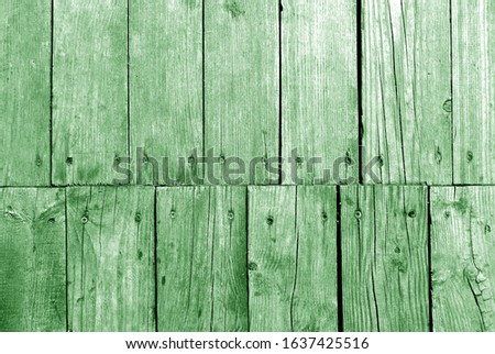 Old grungy wooden planks background in green tone. Abstract background and texture for design.