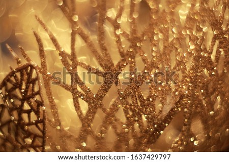 Shiny golden leaves with glitter. Christmas decoraitons.